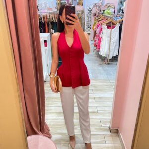 BLUSA HALTER DE BOTONES TIPO PEPLUM DE PIEZAS